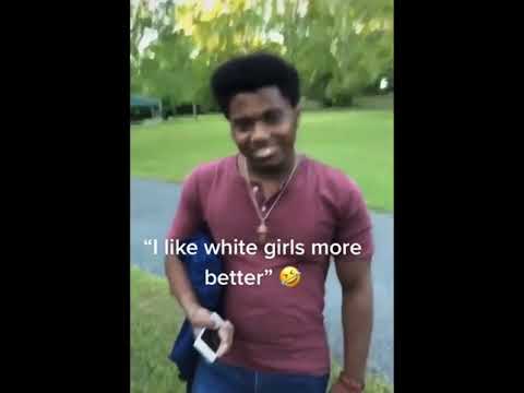 The man from the original clip, standing outdoors in a burgundy shirt.